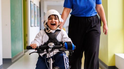 Siddique riding his bike smiling