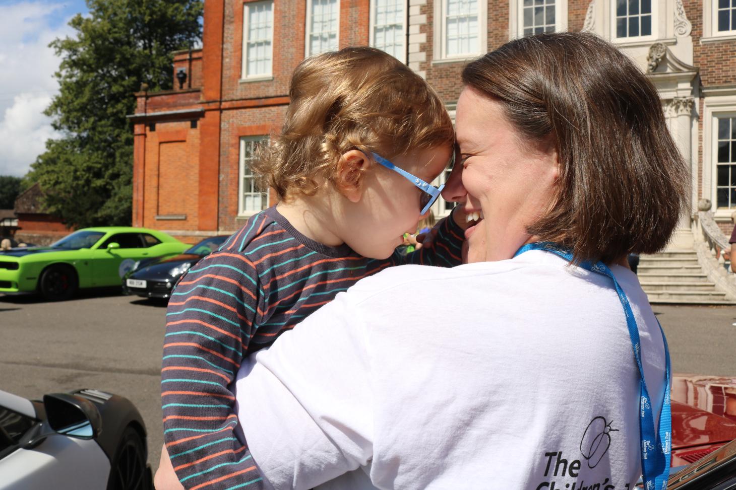 Teddie hugging a member of staff