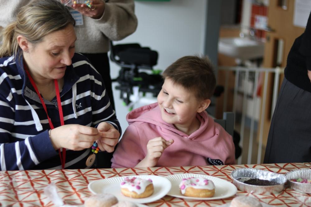Erin decorating doughnuts for National Doughnut Week