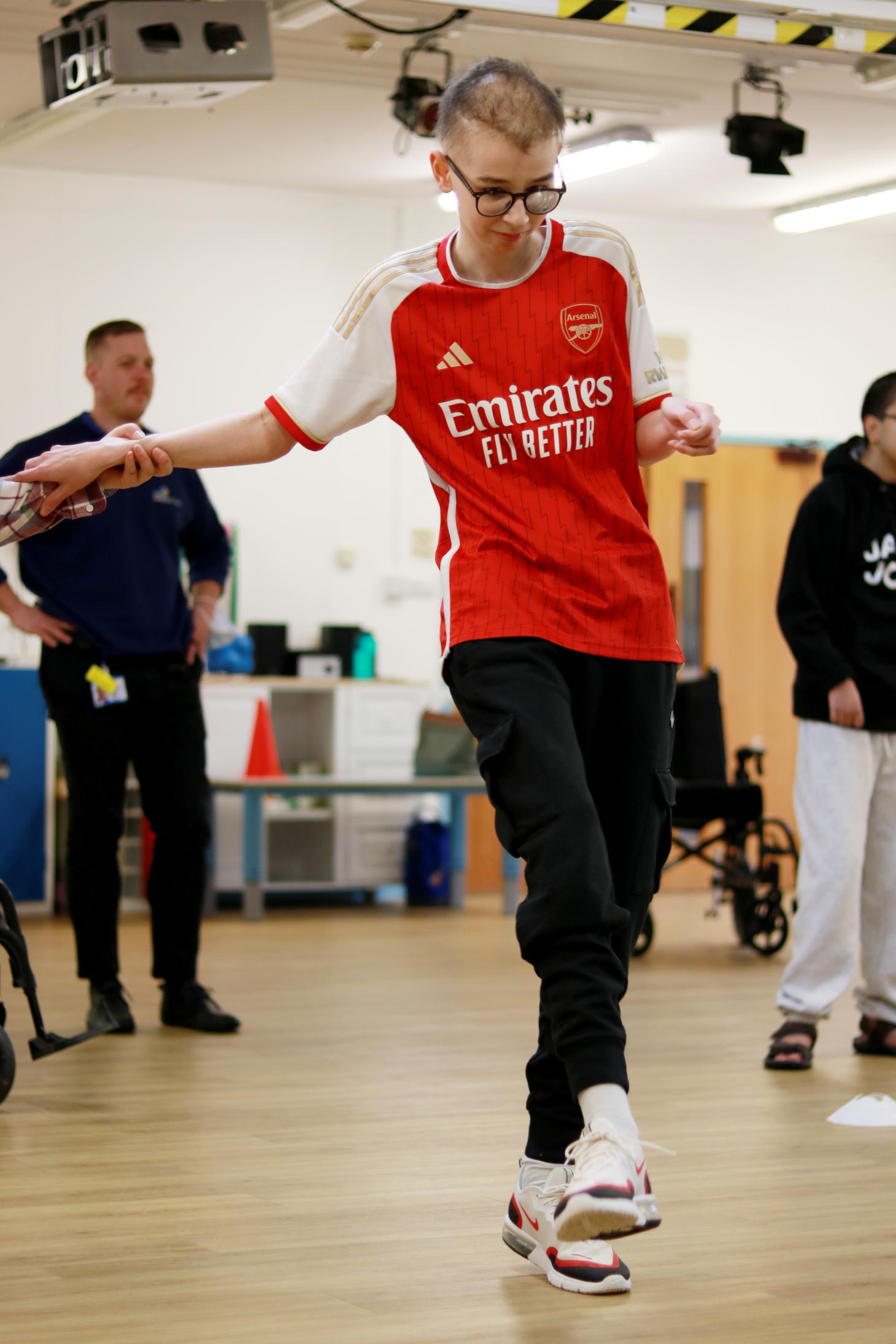 boy kicking a football