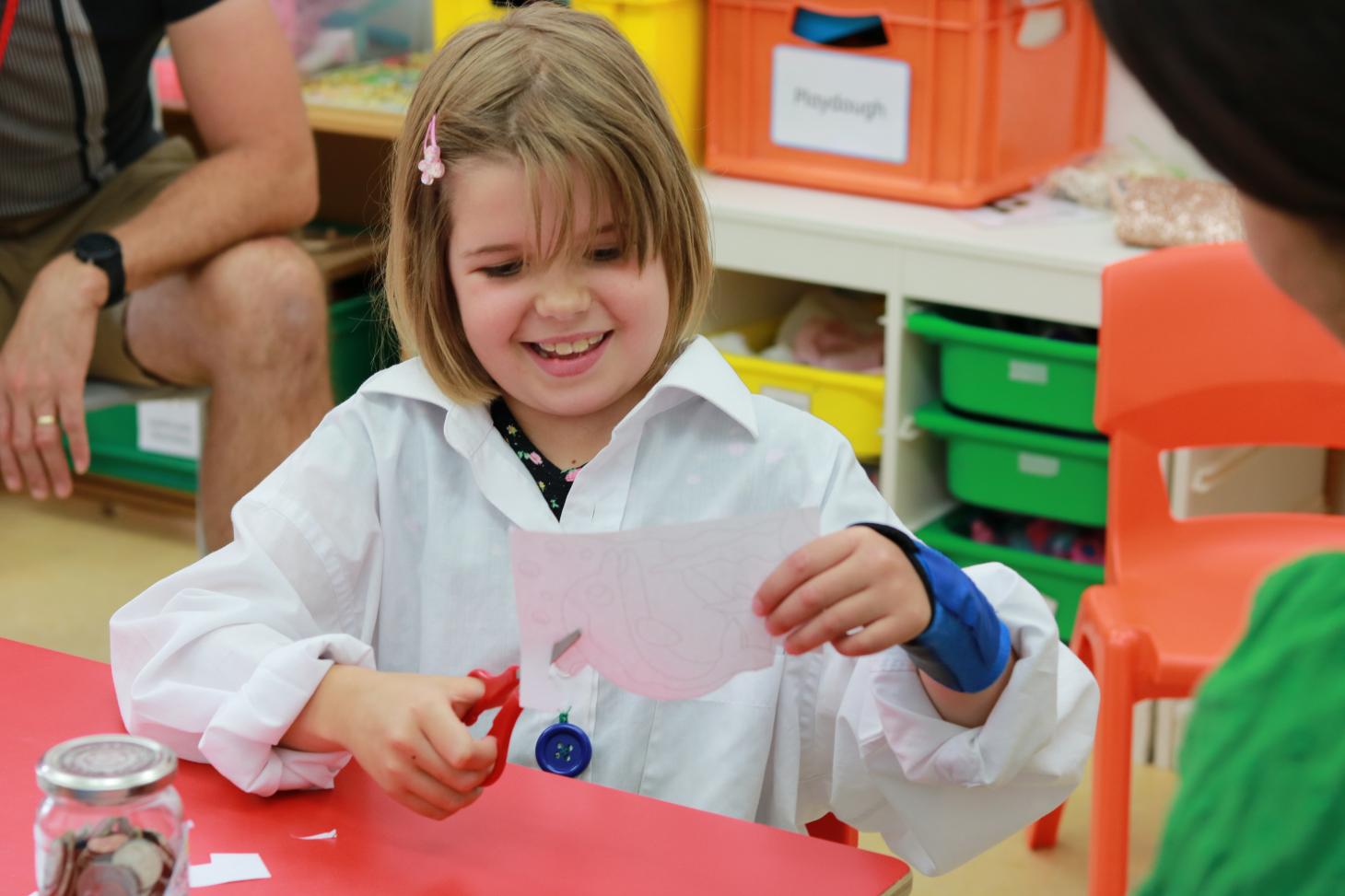 Marnie cutting some paper with scissors