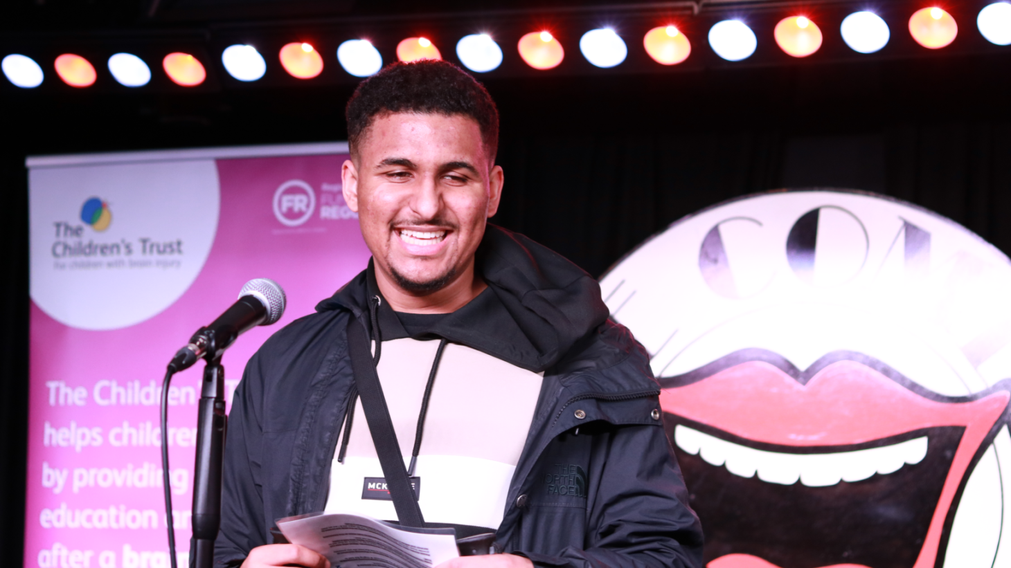 Zac speaking at The Comedy Night 2025