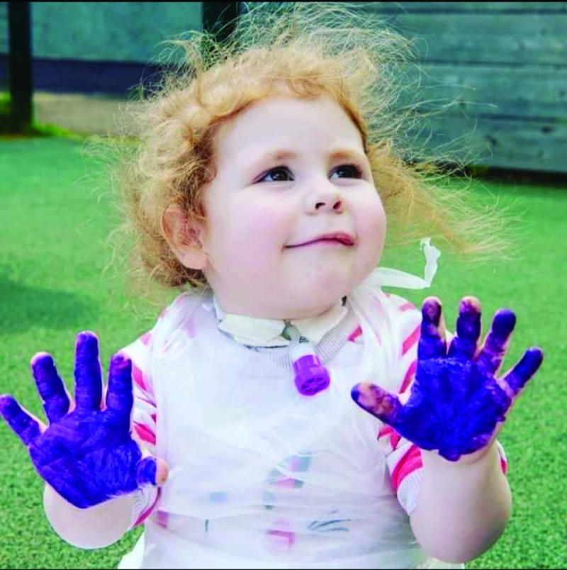 Lillie-Anne hand painting at The Children's Trust