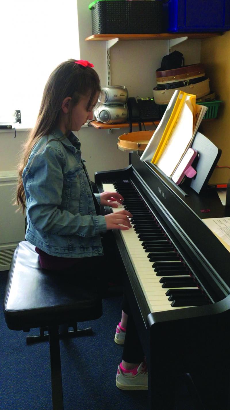 Madison playing the piano