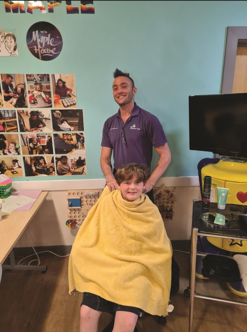 Marli getting a hair cut at The Children's Trust