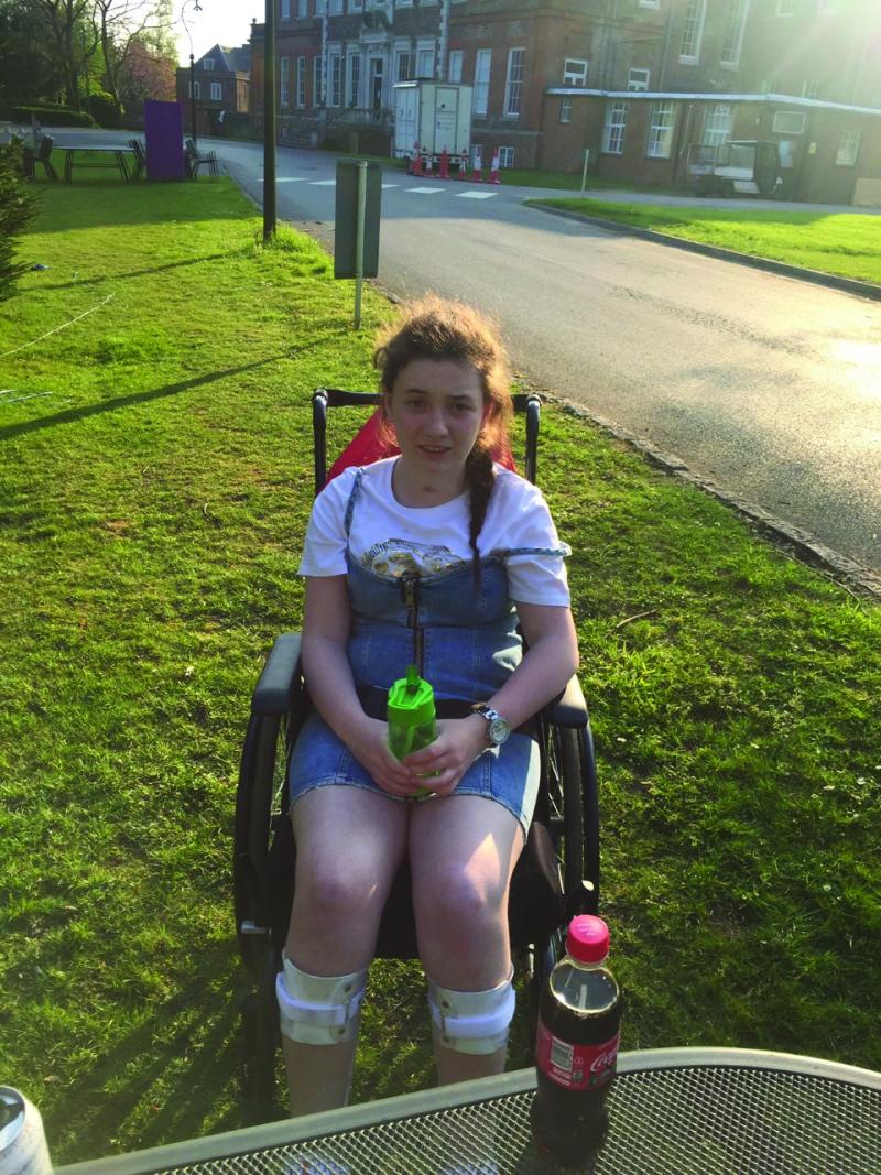 Nieve in her wheelchair on a day out in Tadworth