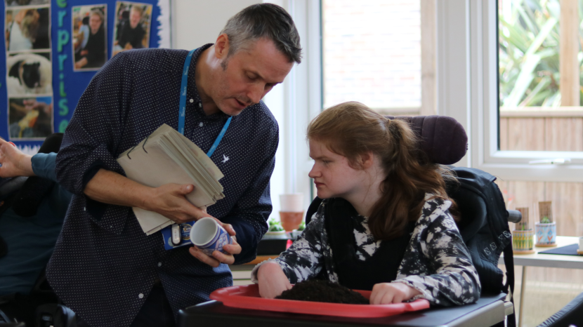 Young person learning about the planting project