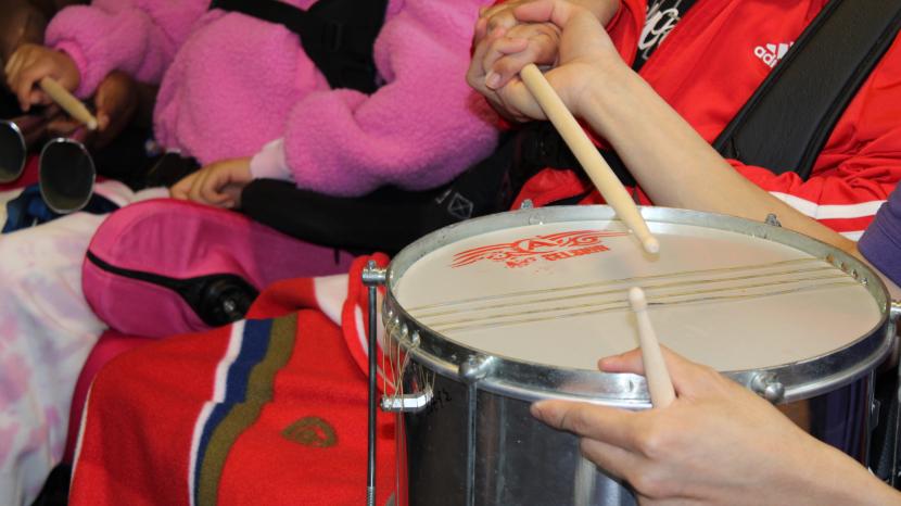 Playing the drums at a music session.