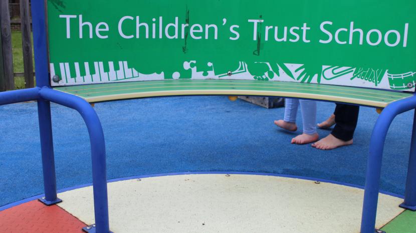 The Children's Trust school logo on a roundabout.