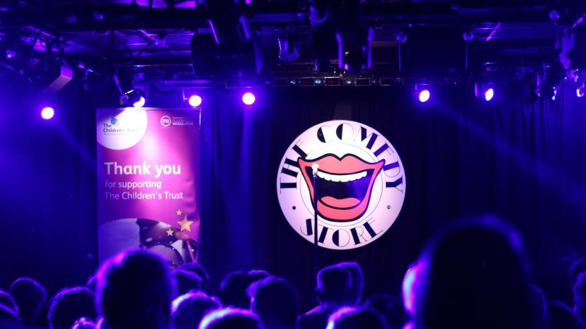 Crowd of people watching the children's trust comedy night 