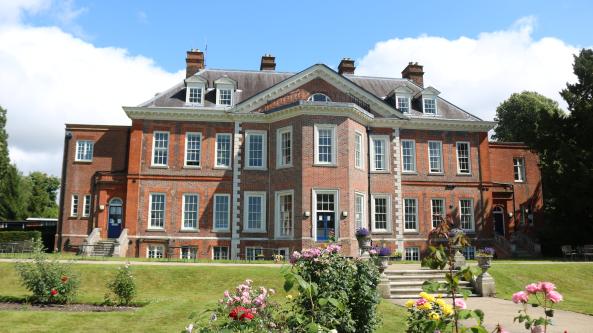 Tadworth Court mansion in the summer